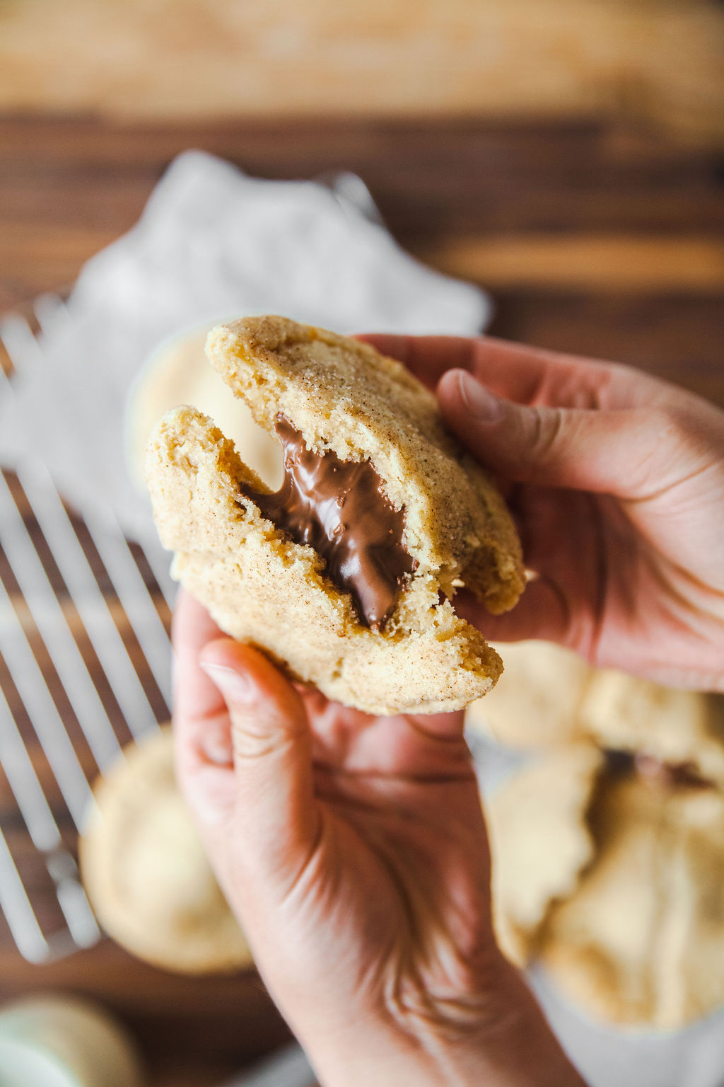 Nutella stuffed chai snickerdoodle split open by hand